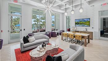 A living room with two couches and a table with chairs